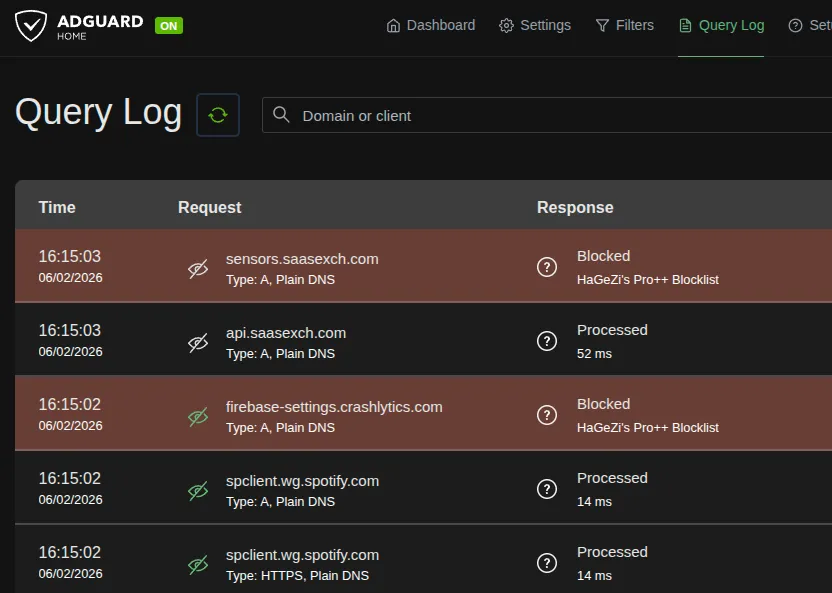 AdGuard Home Query Log showing blocked and allowed queries